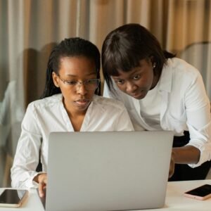 Young woman with laptop receives support