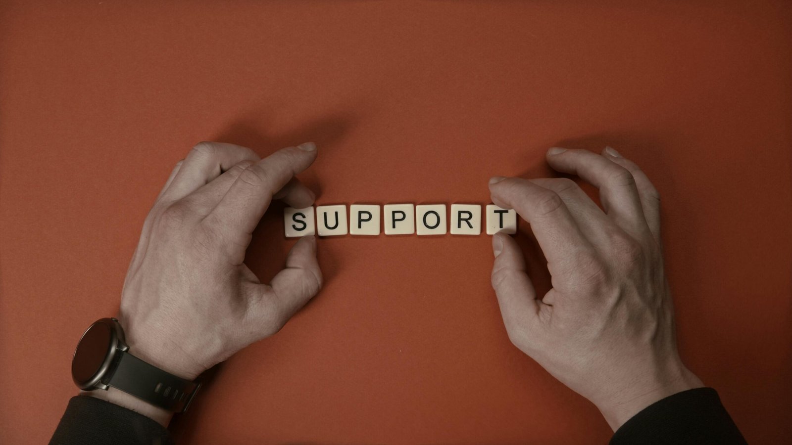 SUPPORT spelled out in Scrabble tiles